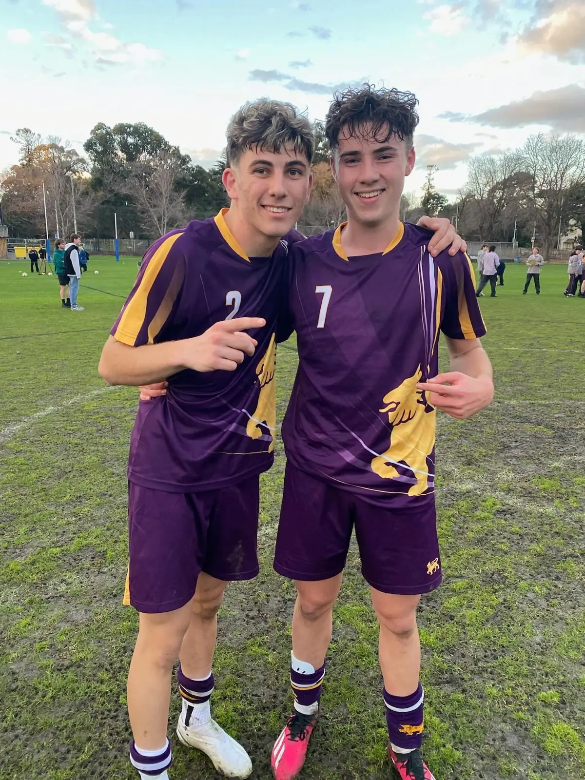Josh and Che in team kit after a match