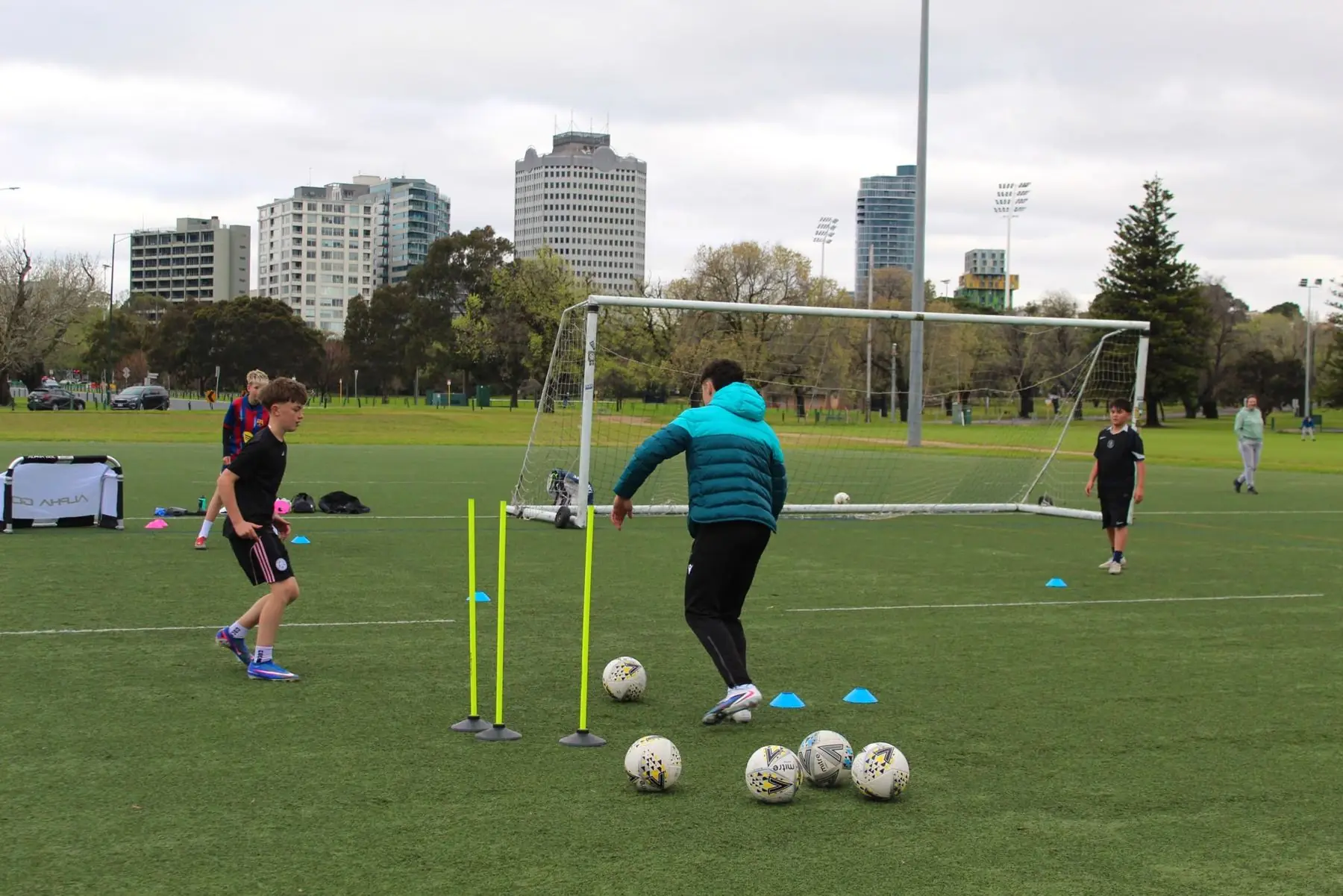 Players working through a dribbling drill in a Melbourne park