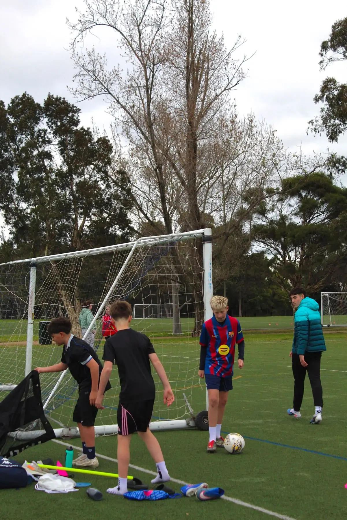 Players warming up beside the goal